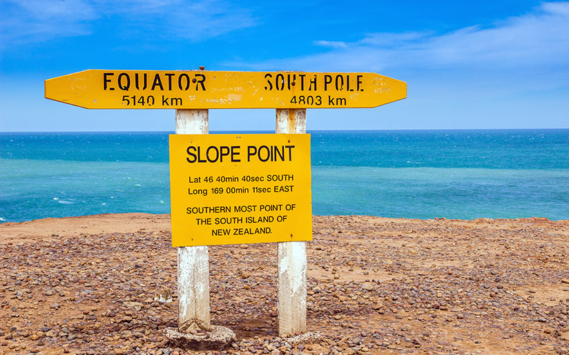 Photo of signs showing distances to the Equator and the South Pole at Slope Point (South Island)